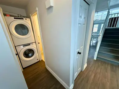 a laundry room with a washer and dryer in a house at Four Season Family Retreat with Pool Access in Collingwood