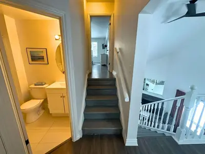 a staircase leading to a bathroom with a toilet at Four Season Family Retreat with Pool Access in Collingwood