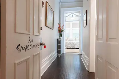 a hallway with a door leading to a bedroom at Stone Maiden Inn in Stratford