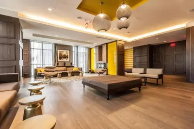 a living room with a couch and a table at Skyline Suites - Walk to MTCC, ACC, Rogers Centre & Entertainment District in Toronto