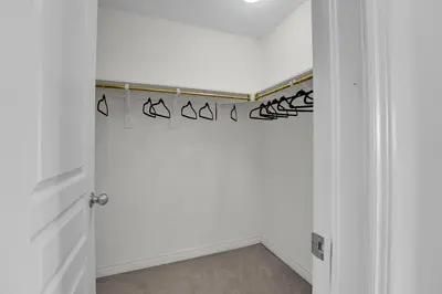 a hallway with a white wall with blackigraphy on it at Spacious Family Friendly Vacation home in Brampton