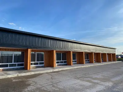 a large building with a row of windows at Motel 400 & Suites in Innisfil