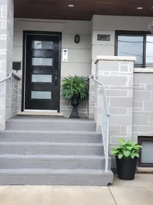 a front door of a house with a plant at Dufferin Serenity Suite in Toronto