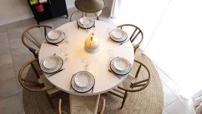 a table with plates and glasses and a pear on it at 5beds 2800 sqft house, sleeps 11, 18 mins to falls in Thorold