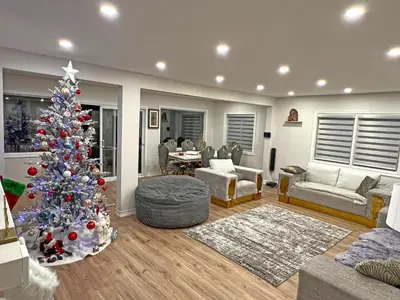 a living room with a christmas tree in it at Charming Cottage on Lake Simcoe in Orillia