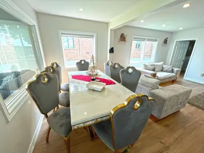 a dining room with a table and chairs at Charming Cottage on Lake Simcoe in Orillia