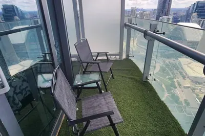two chairs sitting on top of an observation deck at Modern studio High Floor ,CN Tower, ScotiaArena in Toronto