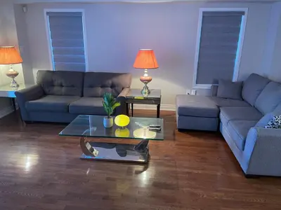 a living room with two couches and a coffee table at Finesse in Whitby