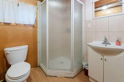 a bathroom with a shower and a toilet and a sink at Dive into Nature in Bailieboro