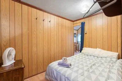 a bedroom with a bed and a fan at Enjoy Rice Lakes in Bailieboro