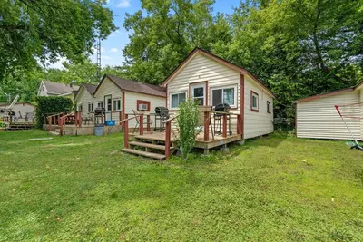 a home with a deck and a house at Enjoy Rice Lakes in Bailieboro