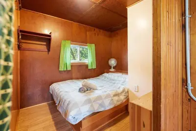 a bed in a small room with a window at Enjoy the Outdoors in Bailieboro