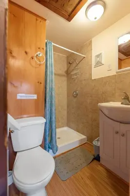 a bathroom with a toilet and a sink and a shower at Enjoy the Outdoors in Bailieboro