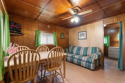 a living room with a table and a couch at Enjoy the Outdoors in Bailieboro