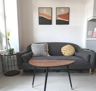 a living room with a couch and a table at KozyStay Toronto in Toronto