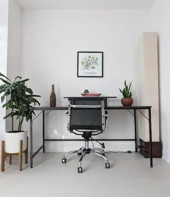 an office desk with a computer monitor and a chair at KozyStay Toronto in Toronto