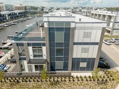 an aerial view of a building with a marina at Casa Lago 5 Bed Waterfront House in Innisfil