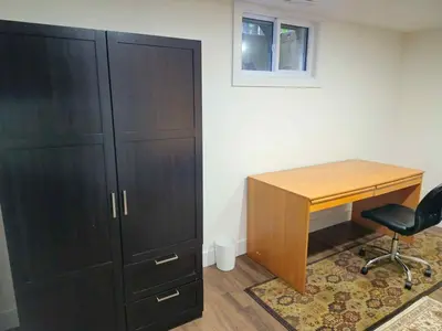 an office with a desk and a cabinet and a chair at Forest city House -Rooms in a family style in London