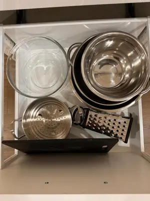 a drawer filled with plates and utensils at 2 Bedroom 1 Parking Basement Unit in Richmond Hill