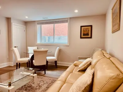 a living room with a couch and a table at 2 Bedroom 1 Parking Basement Unit in Richmond Hill