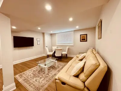 a living room with a couch and a table at 2 Bedroom 1 Parking Basement Unit in Richmond Hill