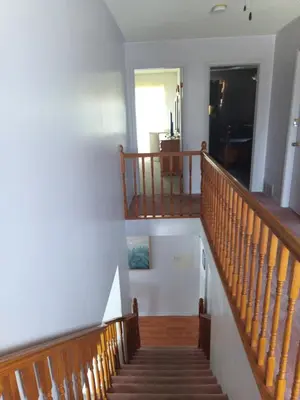 a staircase in a house with a stair case at Princess Motel in Bobcaygeon