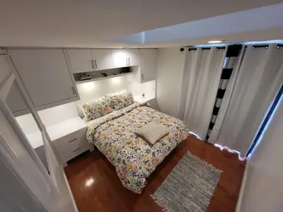a small bedroom with a bed in a small room at Downtown Toronto House Central 2BED 2BATH Subway Free Parking in Toronto