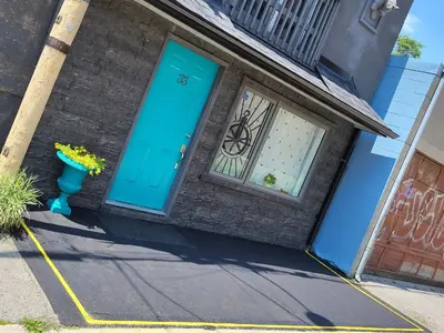 a blue door on a house with a window at Downtown Toronto House Central 2BED 2BATH Subway Free Parking in Toronto