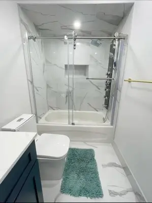 a bathroom with a shower and a toilet and a tub at Elegant & Luxurious 3 Bedroom Home in Mississauga