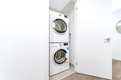 a laundry room with a washer and dryer at Condo Unit with Stunning Views & Amenities in Kitchener