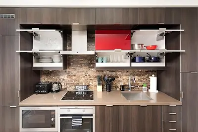 a kitchen with a sink and a counter top at Perfect Condo Sleeps 4 Across from Cn Tower! in Toronto