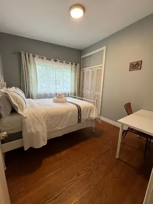 a bedroom with a bed and a window at Lina's Place1 in St. Catharines
