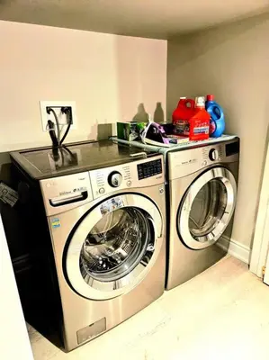 a kitchen with a washing machine and a washer at Spacious Basement in Oakville in Oakville