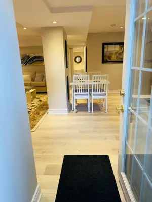 a room with a table and a dining room at Spacious Basement in Oakville in Oakville