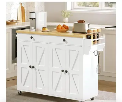 a white kitchen island with a wooden counter top at Maya Bed and Breakfast in Port Perry