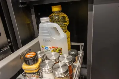 a refrigerator filled with food and a bottle of milk at The Gate Chic & Cozy Basement Retreat in Ajax in Ajax