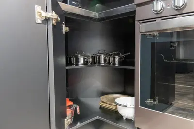 a kitchen with pots and pans on a shelf at The Gate Chic & Cozy Basement Retreat in Ajax in Ajax