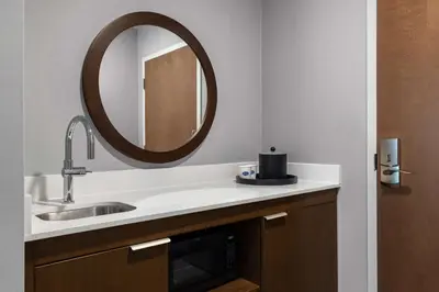 a bathroom with a sink and a mirror at Hampton Inn & Suites Orangeville, On in Orangeville