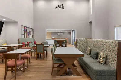 a dining room with tables and chairs and tablesktop at Hampton Inn & Suites Orangeville, On in Orangeville