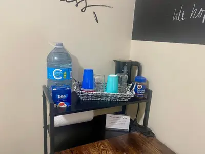 a shelf with water bottles and other items on it at Cobourg Country Home - 10 Minutes From Cobourg Beach! in Cobourg