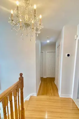 a hallway with a chandelier in a house at Sunny House - Main Floor, Free parking, in Toronto in Toronto