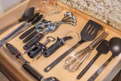 a bunch of utensils on a wooden cutting board at PetFriendly, 2 KingBeds, Gym, Pool, Netflix in Shanty Bay