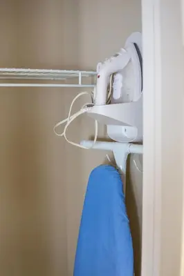 a hair dryer and a blue towel in a room at PetFriendly, 2 KingBeds, Gym, Pool, Netflix in Shanty Bay