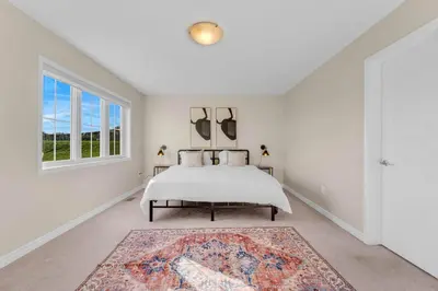 a bedroom with a bed and a window at Spacious Family Getaway Near Nature & Dining in Cambridge
