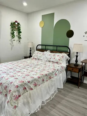a bedroom with a large bed with a white comforter at Private Room Near Airport K3 in Mississauga
