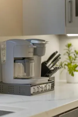 a coffee maker sitting on top of a counter at Spruce Suite in Niagara on the Lake