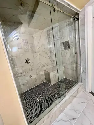 a shower with a glass door in a bathroom at Private Room Near Airport K9 in Mississauga