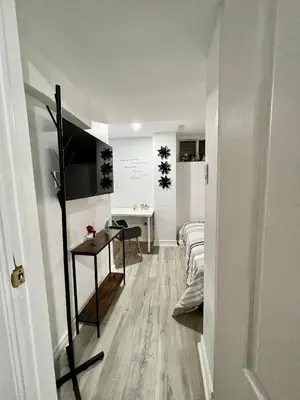 a living room with a couch and a table at Private Room Near Airport K9 in Mississauga