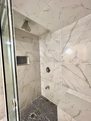 a bathroom with a shower with a glass door at Private Room Near Airport K8 in Mississauga