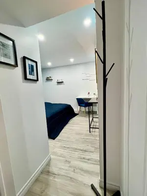 a hallway with a desk and a table in a room at Private Room Near Airport K8 in Mississauga